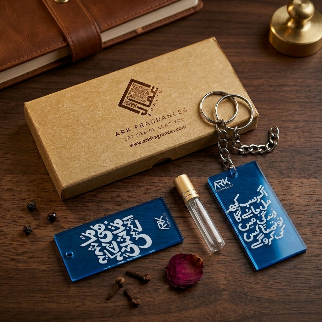 Premium blue acrylic keychain featuring the Urdu poetry Agar Sab Kuch Mil Jayega, placed next to an ARK Fragrances luxury box and a perfume tester vial.