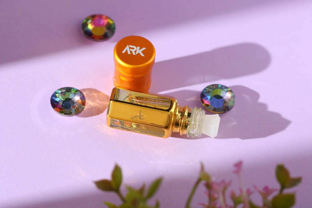 Aabir Attar by ARK Fragrances 3ml concentrated perfume oil with glass stick applicator displayed with crystals on purple background best luxury scent gift online delivery in Lahore Karachi Islamabad Faisalabad and Pakistan