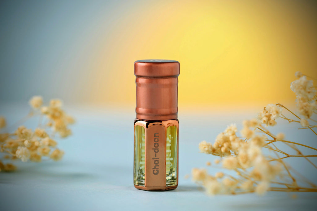 Ghai Daan Attar by ARK Fragrances 3ml premium concentrated perfume oil displayed with dried flowers best natural scent online delivery in Lahore Karachi Islamabad Faisalabad and Pakistan