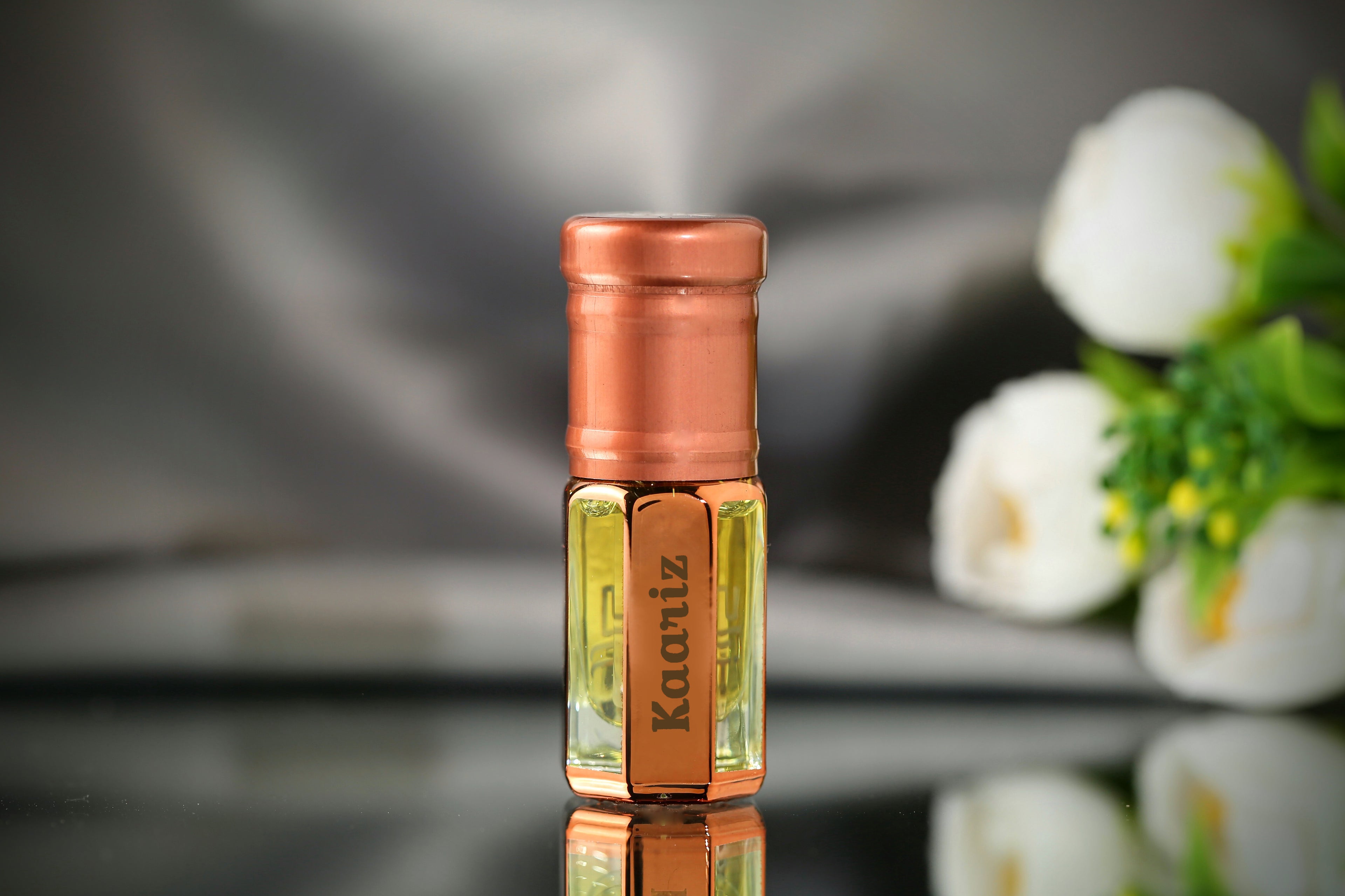 Kaariz Attar by ARK Fragrances premium concentrated perfume oil in rose gold bottle elegant soft scent alcohol free available in 3ml 6ml and 12ml sizes best gift for men and women