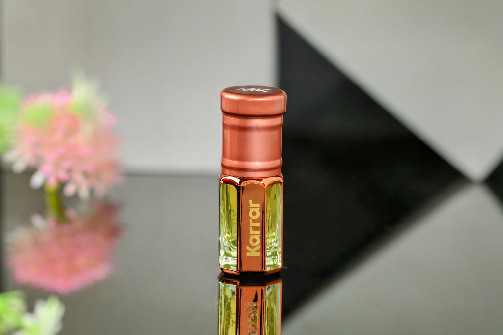 Karrar Attar by ARK Fragrances premium concentrated perfume oil in rose gold bottle modern sleek black background alcohol free available in 3ml 6ml and 12ml sizes best evening scent