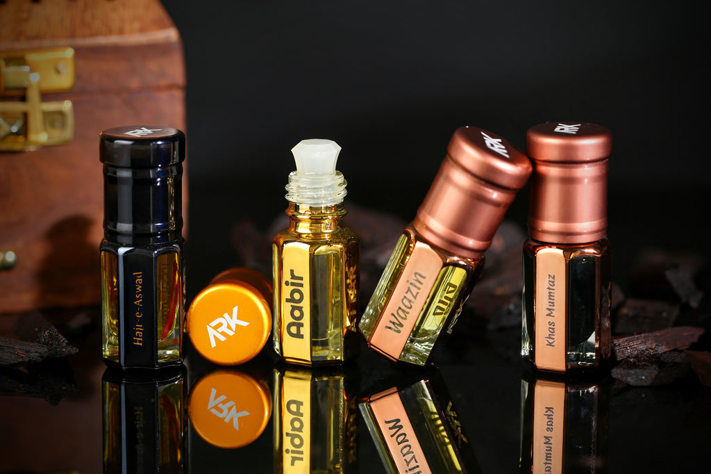 Luxury attar collection by ARK Fragrances featuring Hajr e Aswad Aabir Waazin and Khas Mumtaz concentrated perfume oil best traditional scent gift set online delivery in Lahore Karachi Islamabad Faisalabad and Pakistan