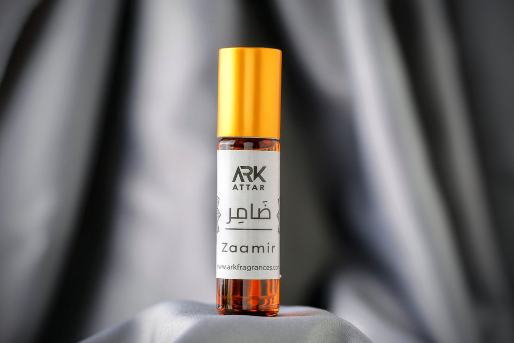 Zaamir Attar by ARK Fragrances 6ml roll-on. A refreshing Spring fragrance featuring vibrant top notes of Bergamot and Pineapple, heart notes of Pink Pepper and Florals, and a complex base of Agarwood Oud, Cardamom, Tonka Bean, and Vanilla. Perfect daily wear branded perfume in Karachi, original fresh scent in Lahore, luxury attar in Islamabad, and best-selling fragrance delivery in Sialkot, Hyderabad, and all over Pakistan.