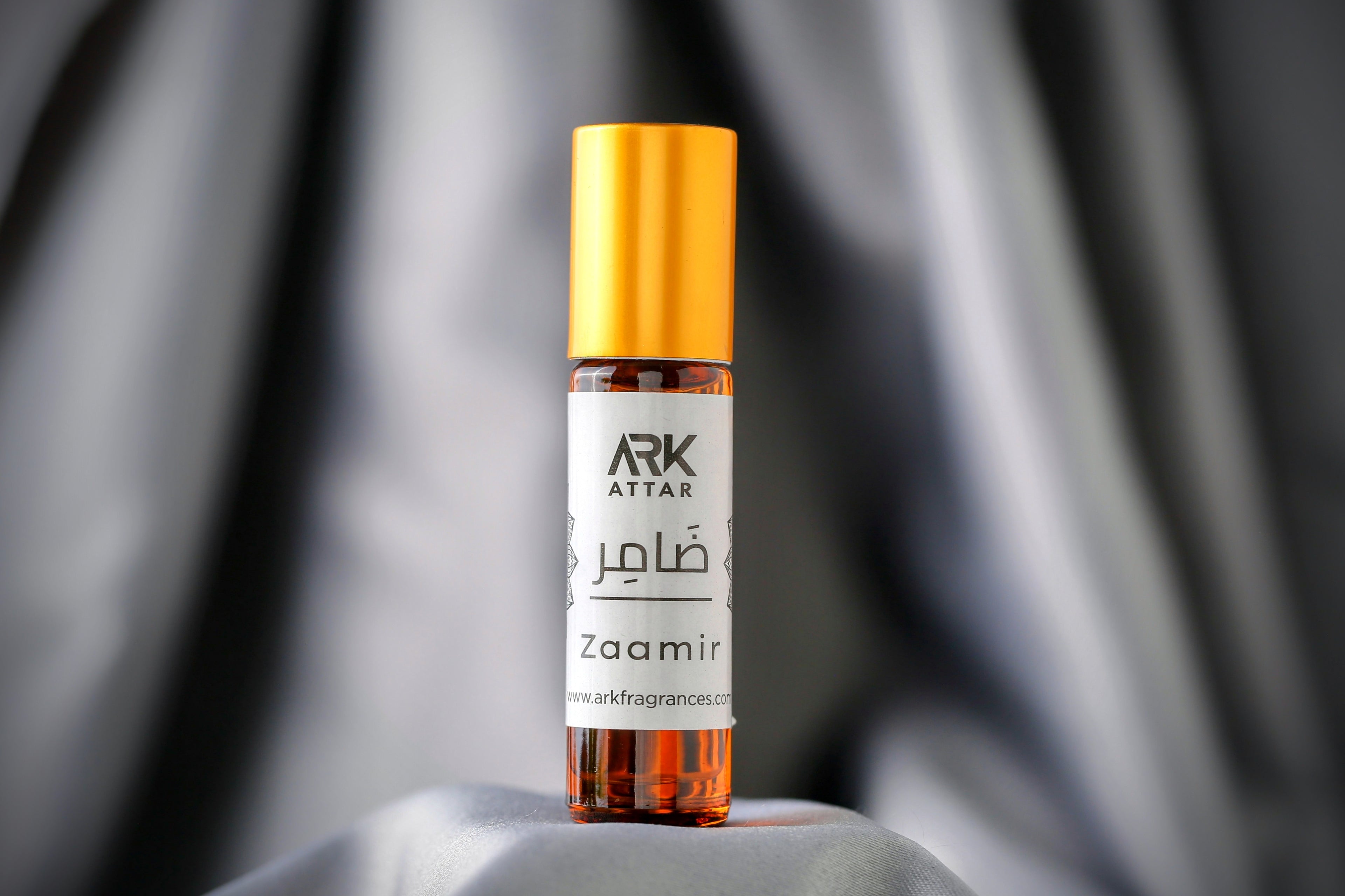 Zaamir Attar by ARK Fragrances 6ml roll-on. A refreshing Spring fragrance featuring vibrant top notes of Bergamot and Pineapple, heart notes of Pink Pepper and Florals, and a complex base of Agarwood Oud, Cardamom, Tonka Bean, and Vanilla. Perfect daily wear branded perfume in Karachi, original fresh scent in Lahore, luxury attar in Islamabad, and best-selling fragrance delivery in Sialkot, Hyderabad, and all over Pakistan.
