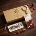 Premium acrylic calligraphy keychain featuring the Arabic word Hubb (Love) in red and black, placed next to a luxury ARK Fragrances gift box.