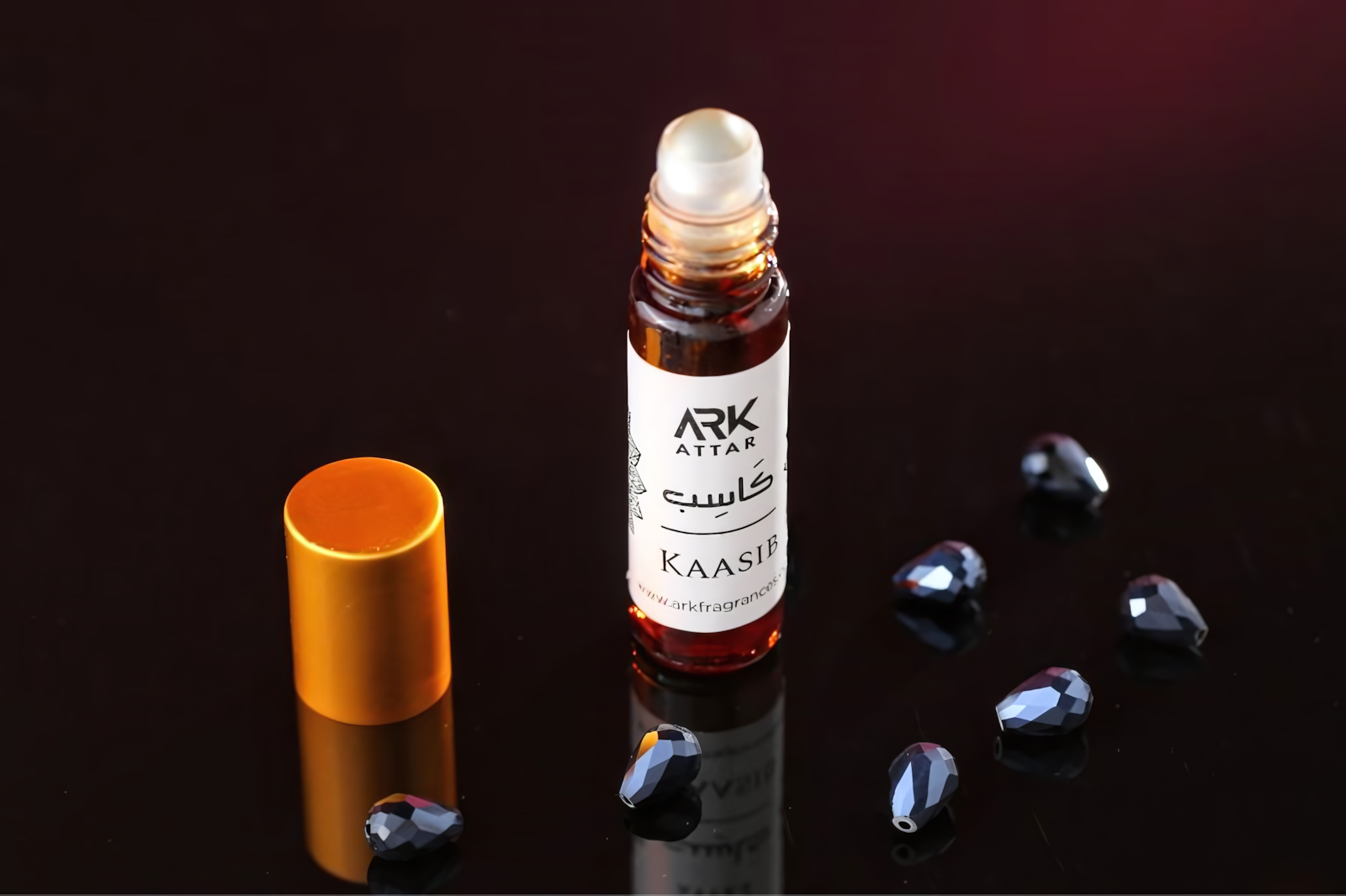 Kasib Attar by ARK Fragrances, a grounded blend of woody musk and amber designed for the hardworking man.