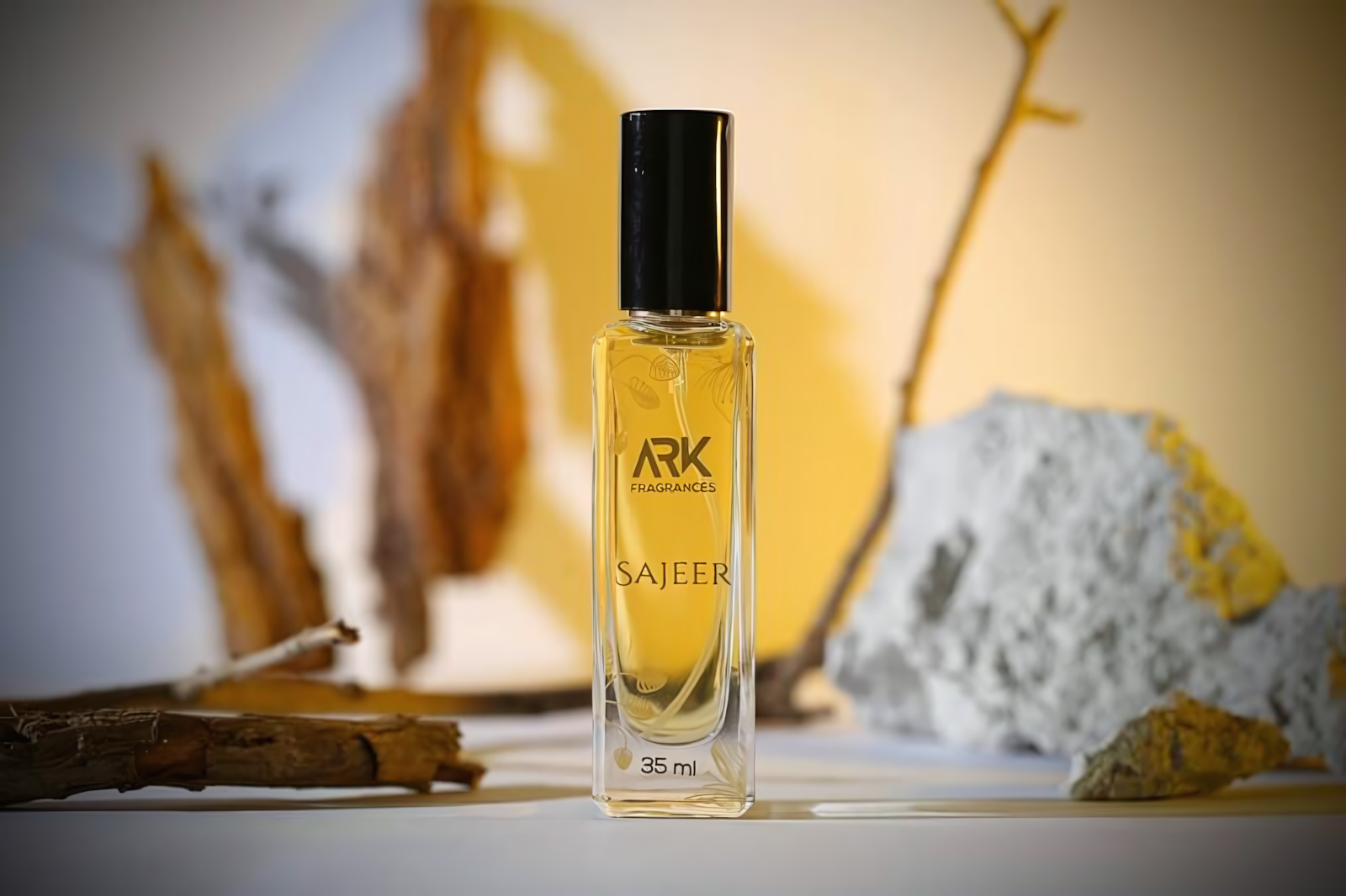 Premium Sajeer 35ml unisex perfume bottle by ARK Fragrances showcase, highlighting its high-quality glass packaging and intense amber-musk trail that lasts over 12 hours on all fabric types.